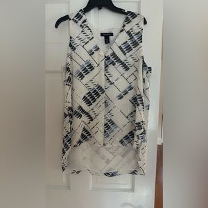 This blouse us in shades of blue, white and silver